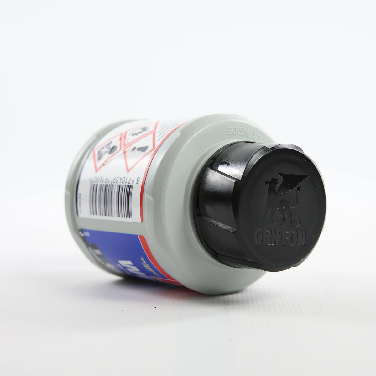 Клей для flex PVC_ABS Griffon WDF-05 0,25 л — банка лежить на боці, чорна кришка показана крупним планом